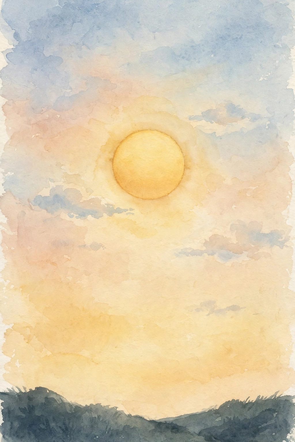 A wide dawn sky with a big low sun above a dark ridge